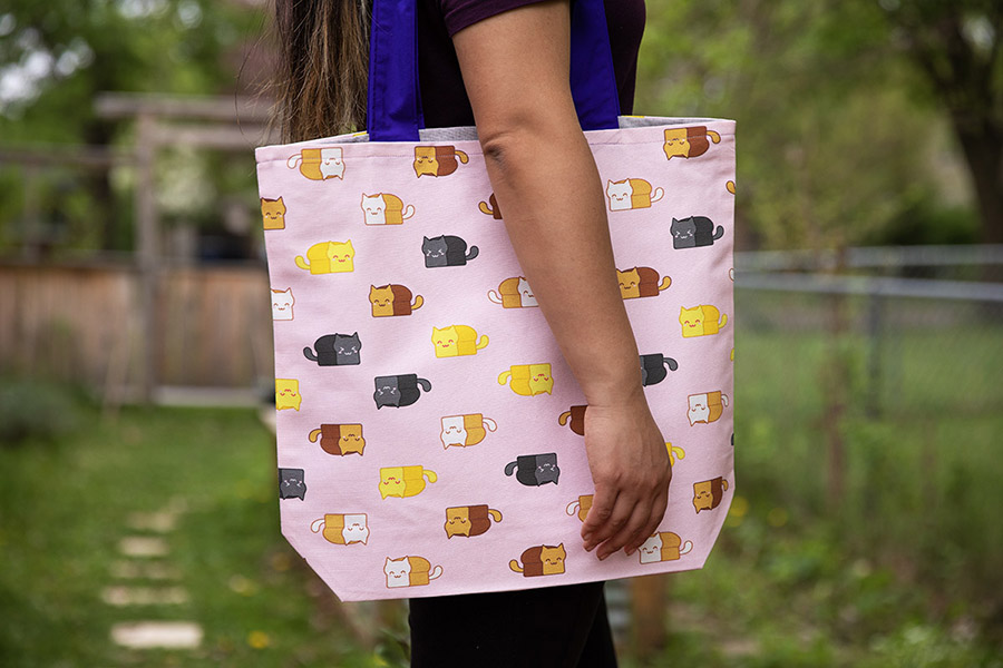 tote bag featuring Meow-Bao the Catloaf surface pattern design by Sophia Adalaine Zhou